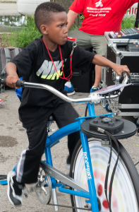 One young man uses the  Blender Bike to generate power.  © Alston Co. Photo